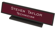 Need a custom desk name plate? Shop our 1 3/4" X 9" custom desk name plates with square corners and black plastic holder included at the EZ Custom Stamps Store.